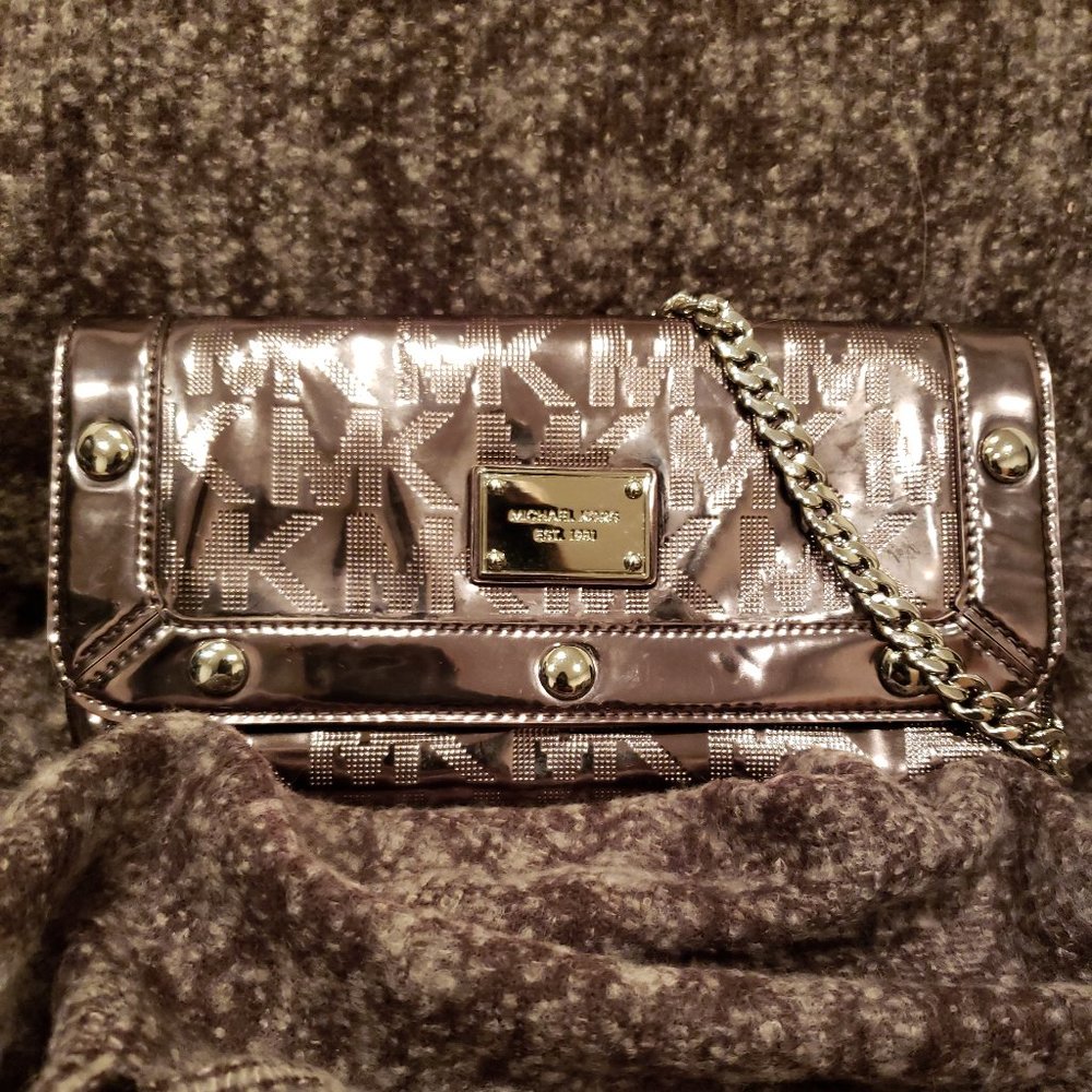 SOLD. Michael Kors Signature Stud Silver Clutch